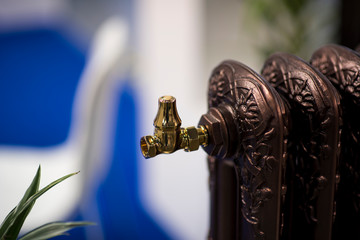 bronze water heating battery with vertical and horizontal fins and end nut. Convection and heat exchange.