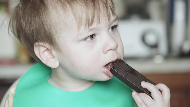 Boy eats hematogen