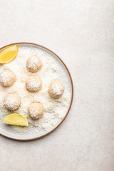 Homemade Raw Vegan Coconut and Lemon Truffles on White Background