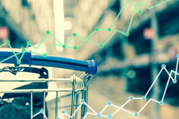 Fototapeta na wymiar Business trading graph on shopping cart background