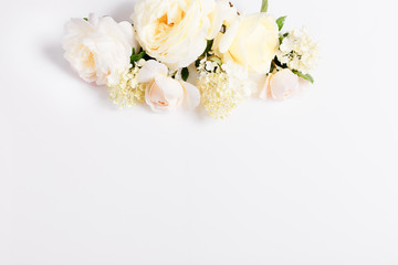 Festive flower composition on the white background. Overhead view