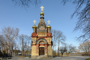 Fototapeta na wymiar Gomel Palace and Park Ensemble. View of the chapel-tomb of the Paskevich family. Carved stone and art metal, red terracotta and multicolor majolica, smalt mosaic and wall paintings.