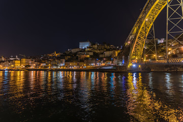 Fototapeta na wymiar Night city skyline of Porto in Portugal with the Ponte Luis I bridge