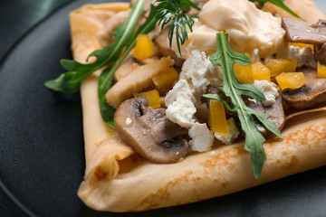 Delicious breakfast with thin pancakes on plate, closeup