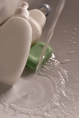 people washing hands in sink with a bar of soap to kill coronavirus disease with Alcohol-based hand sanitizer and antibacterial soap to fight germs in a running water. stay home and wash your hands