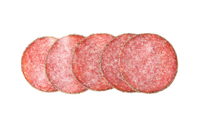 Slices of tasty sausage on white background, top view