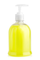 Yellow liquid soft soap in transparent bottle with pump isolated on white background. Cosmetic product for hygiene.