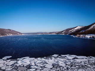Angara River source and frozen Baikal Lake view, Russia