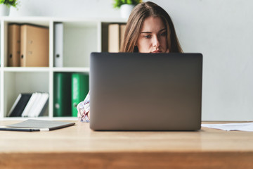 Frustrated brunette female freelancer has just got bad news