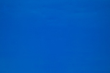 Blue background. Metal painted with blue paint.