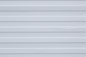 Corrugated sheet wall white .Building material for house cladding .