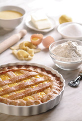 Sweet Pie/Tart on Plate, Made in Italy with Ingredients on Kitchen Counter