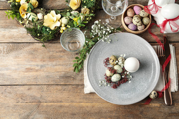 Festive Easter table setting with beautiful floral decor, flat lay. Space for text