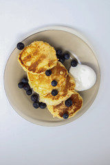 pancakes with blueberries and chocolate syrup