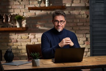 Business man working in home office using laptop