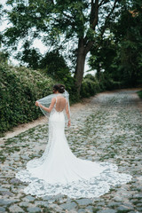 Fototapeta na wymiar Beautiful bride and her wedding dress