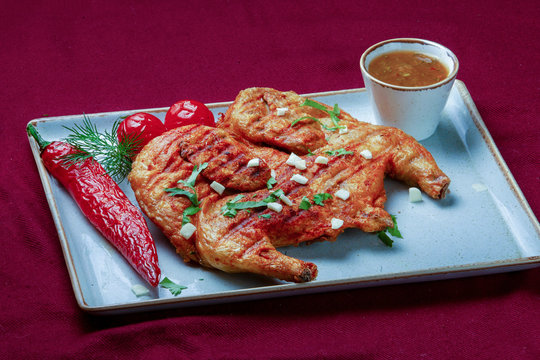 Fried Chicken Topaka or Tabaka in Georgian cuisine