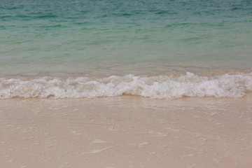 Fototapeta na wymiar Sea beach sand seashore waves small waves