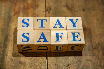 Wooden cubes with lettering Stay Safe in blue letters