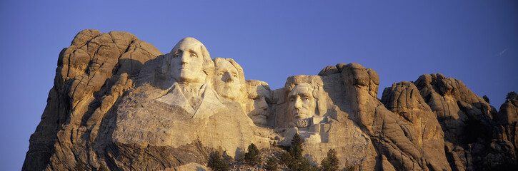 Panoramic sunrise view on Presidents George Washington, Thomas Jefferson, Teddy Roosevelt and Abraham Lincoln at Mount Rushmore National Memorial, South Dakota