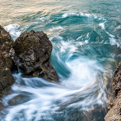 waves crashing on rocks