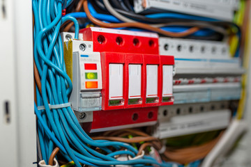 Surge arrester used to protect the electrical system in the building during electrical discharges,...