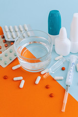 Set of pills and bottles of nose drops for treatment various viruses symptoms. Treatment of seasonal allergic rhinitis or flu.