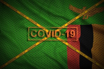 Zambia flag and Covid-19 stamp with orange quarantine border tape cross. Coronavirus or 2019-nCov...