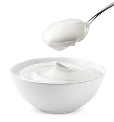 Fotobehang sour cream in bowl and spoon, mayonnaise, yogurt, isolated on white background, clipping path, full depth of field © grey