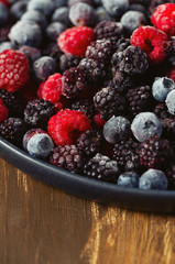 frozen raspberries, blackberries and blueberries close up