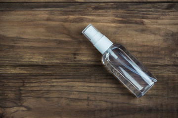 antiseptic spray on a wooden background