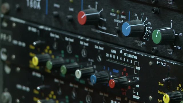 Audio console ; Control panel on the audio mixer with knob potentiometers