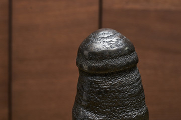 large fragment of pyrite texture on a wooden background