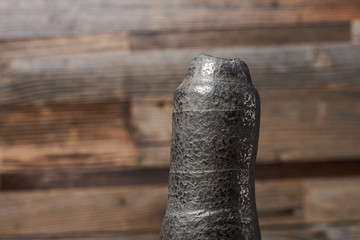 large fragment of pyrite texture on a wooden background