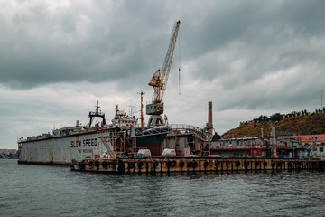 Ships in floating dry dock under repair