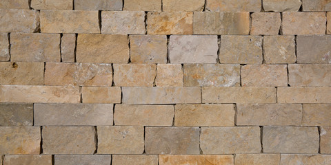 Brown paving stone tilled wall texture masonry background