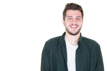 Portrait of a handsome young man smiling against white background aside copy space