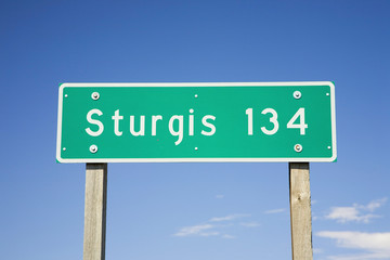 Highway sign reading Sturgis 134 miles on State Highway 34 heading towards the 67th Annual Sturgis...