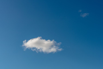 Two little clouds in the blue sky
