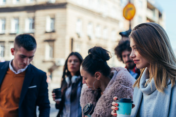 Friends Bonding, group of multi-ethnic friends walking on the streets talking to each other and smiling.