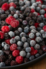 frozen raspberries, blackberries and blueberries close up