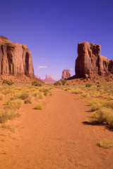Fototapeta premium Red buttes and colorful spires of Monument Valley Navajo Tribal Park, Southern Utah near Arizona border