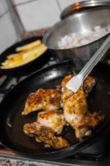 Chicken meat cooked in the pan in the home kitchen