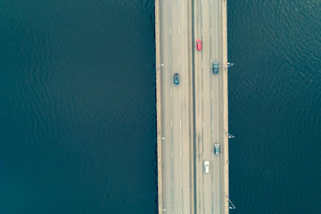 Aerial top view drone shot of bridge with cars on bridge road image transportation background concept.