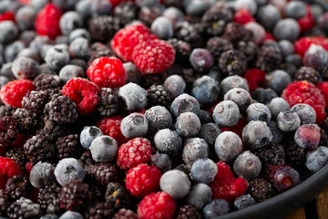 frozen raspberries, blackberries and blueberries close up