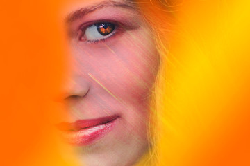 Art woman portrait on an orange background