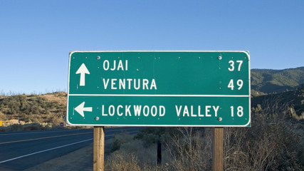 California road sign pointing to Ojai, Ventura and Lockwood Valley, California off highway 33