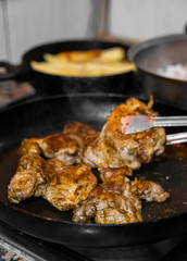 Chicken meat cooked in the pan in the home kitchen