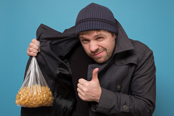 Smuggler selling food. Dealer in hat and coat offering to buy pasta. Deficit of food because of...