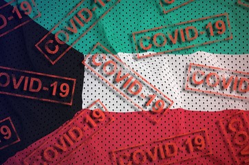 Kuwait flag and many red Covid-19 stamps. Coronavirus or 2019-nCov virus concept